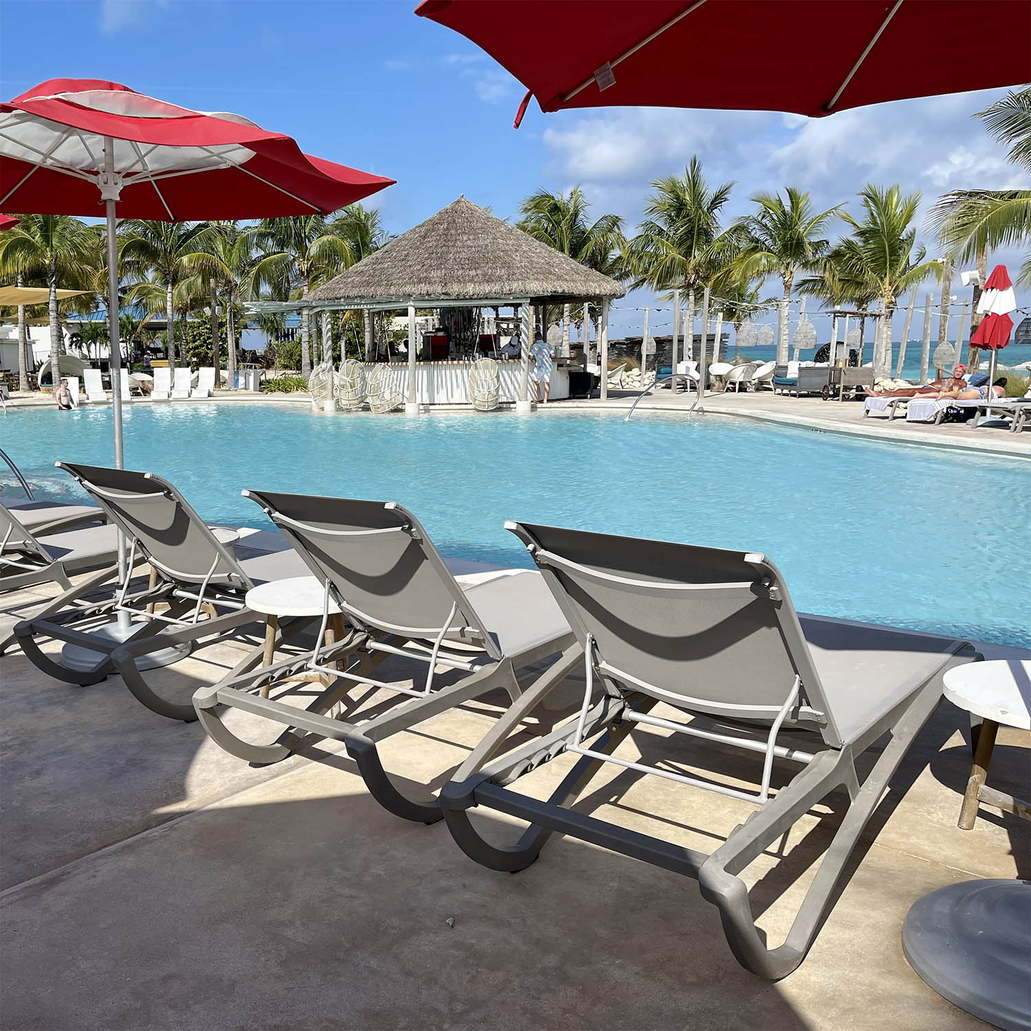 Sunset Chaise Lounges overlook the pool at Bimini Beach Club