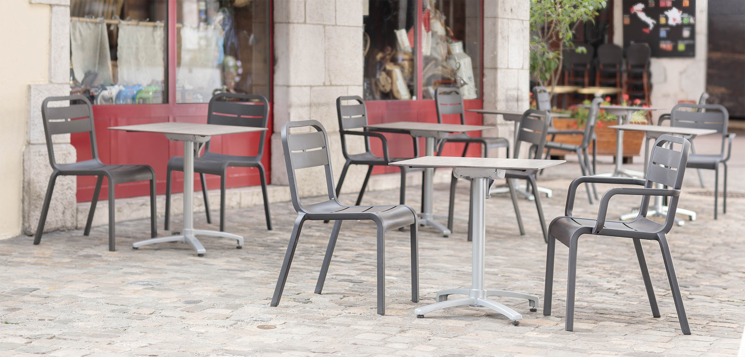 Cannes dining chairs on an outdoor restaurant patio
