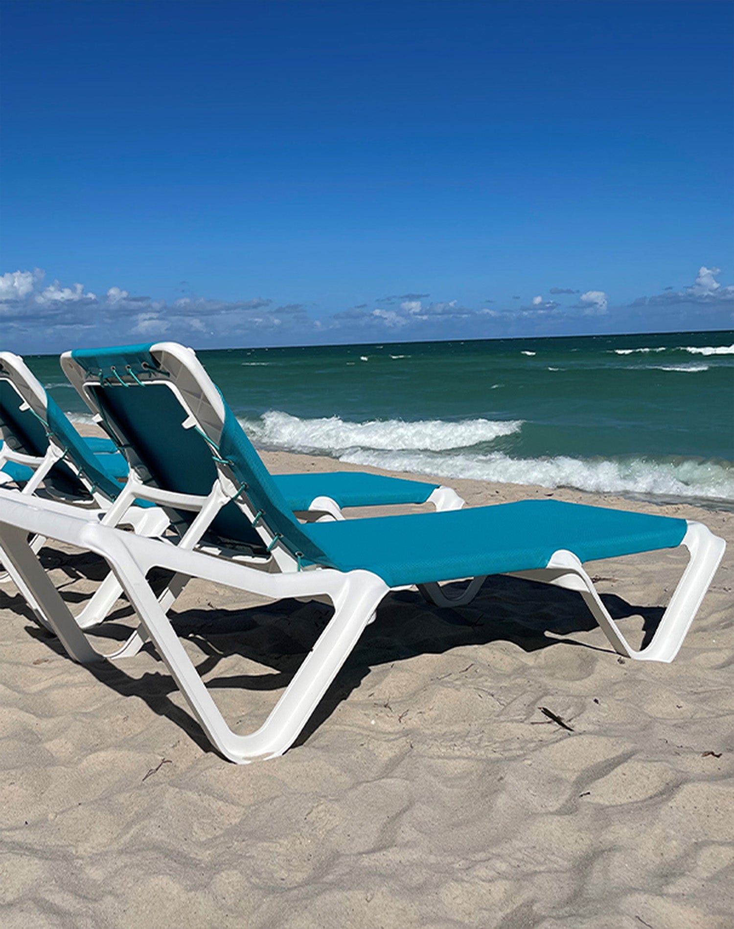 Nautical Chaise Lounges on the beach at Carillon Wellness Resort