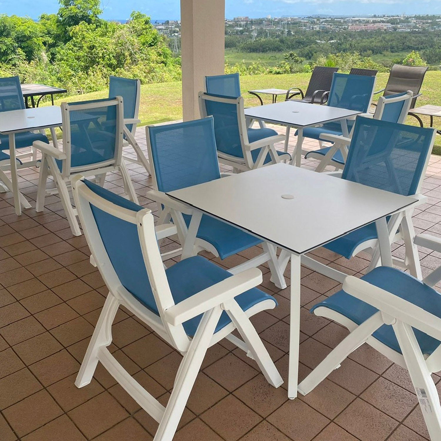 Jamaica Beach Folding Chairs and Sunset Tables under the pavilion at Holiday Tower Condos