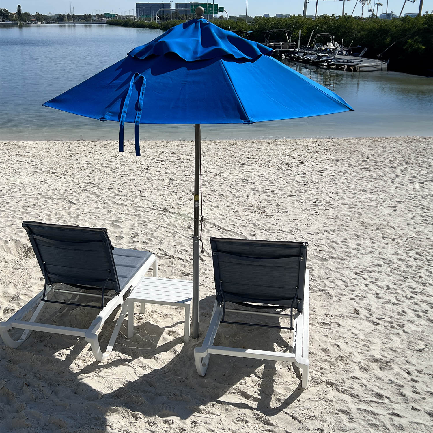 A pair of Sunset Comfort Chaise Lounges side by side on the beach