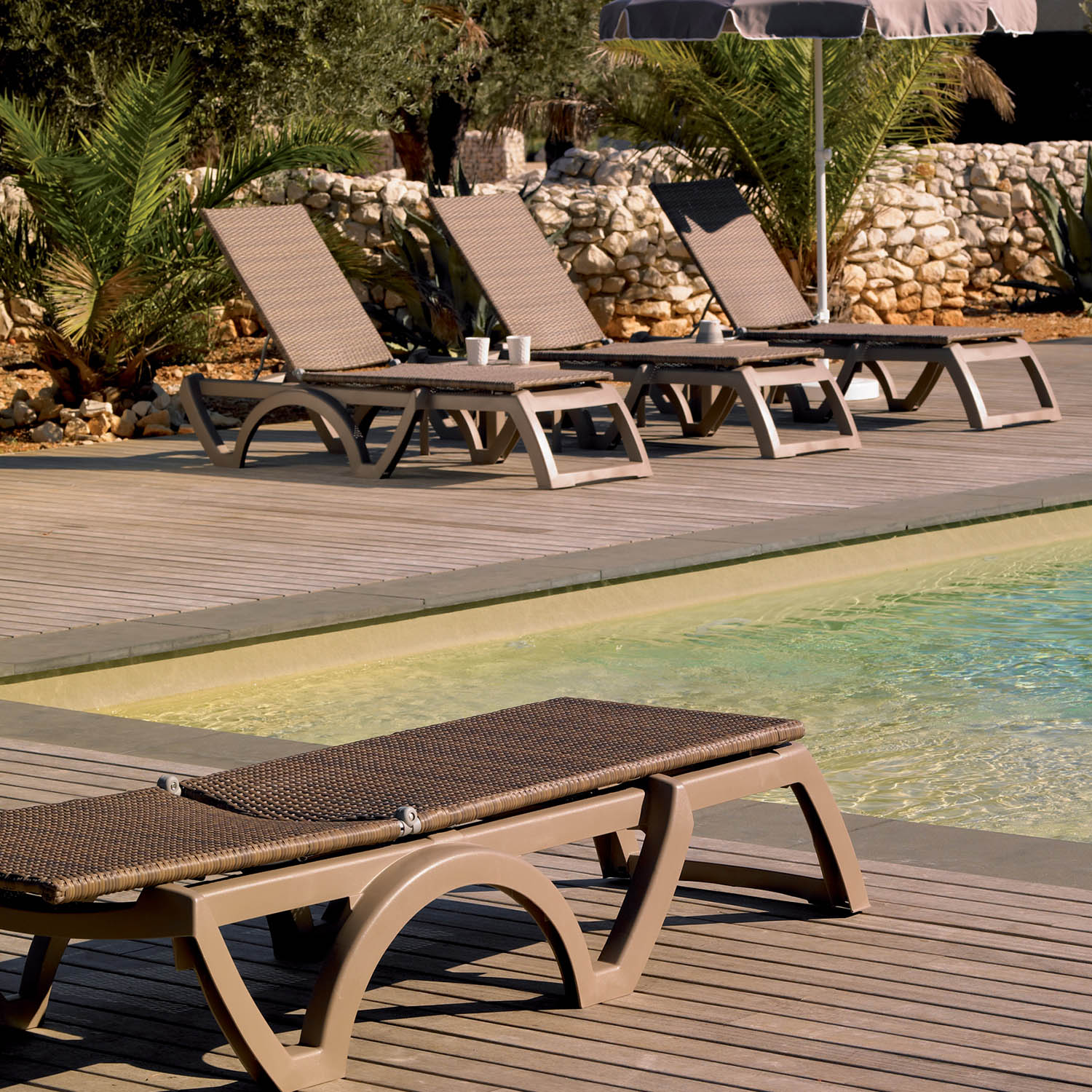 Resin Chaise Lounges by the pool