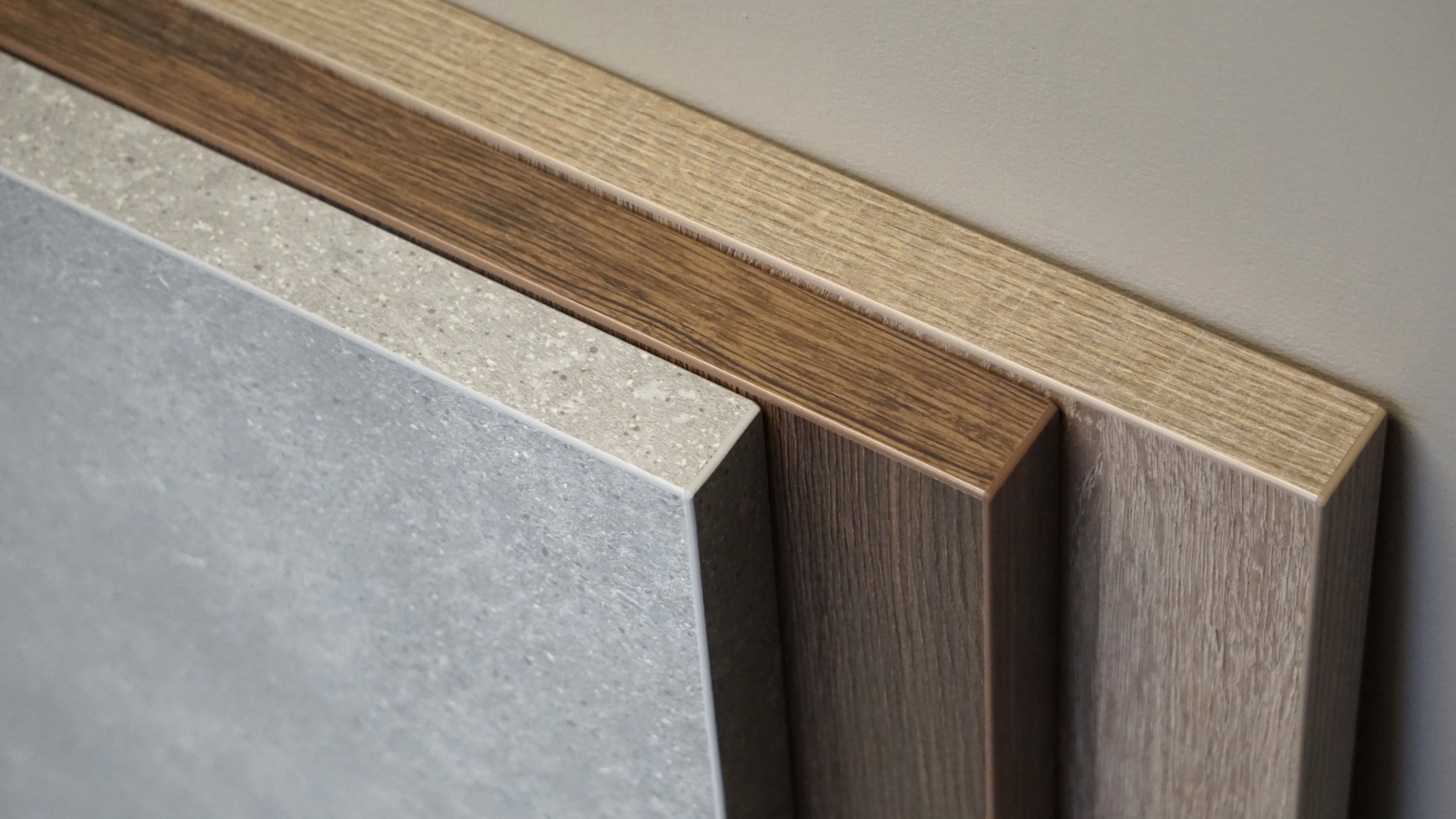 an image closeup of three tabletops stacked together in a few different decors