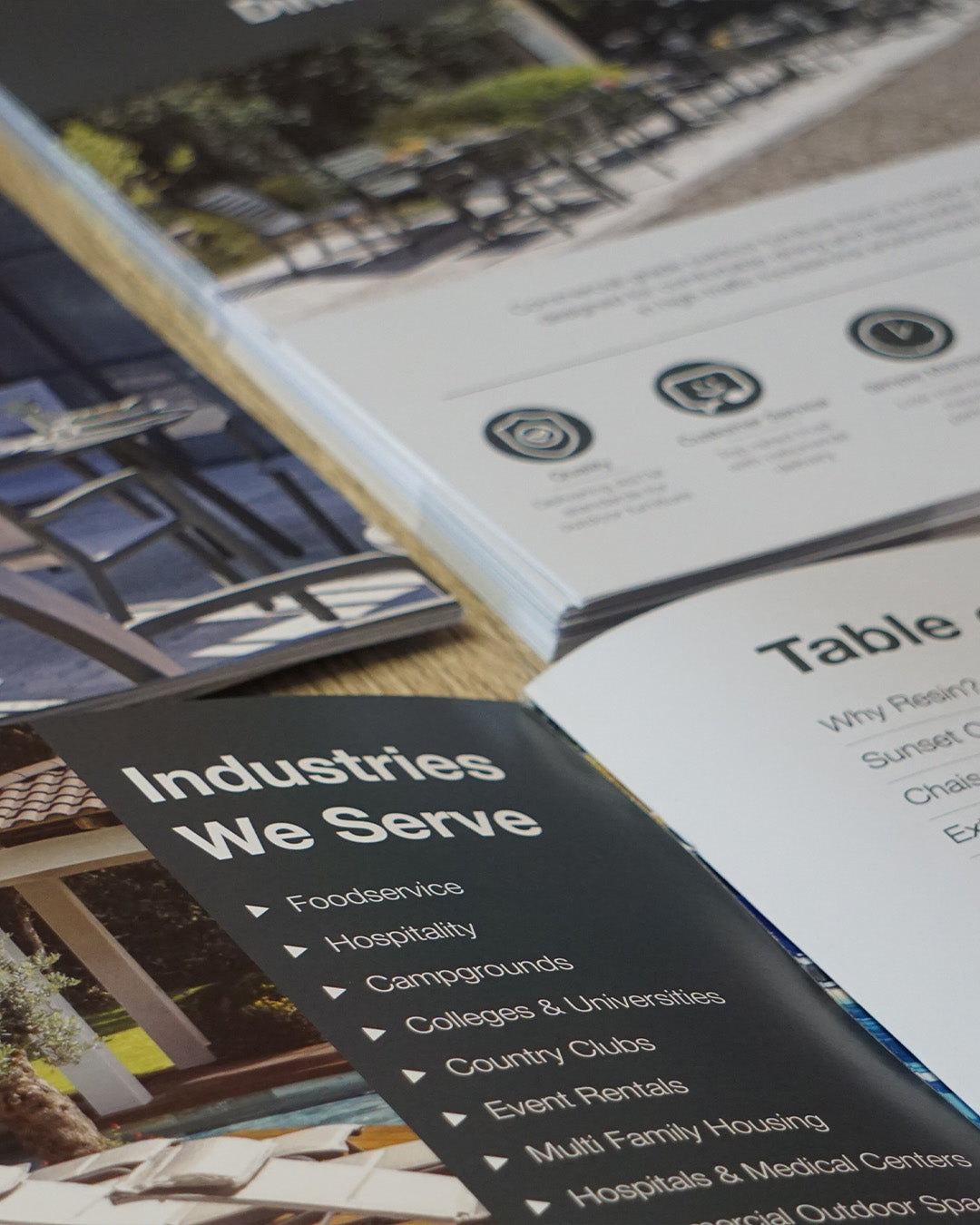 Open book or brochure showing a section titled 'Industries We Serve' with images and text.